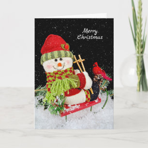 muñeco de nieve de Navidad en trineo