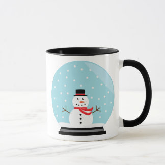 Muñeco de nieve en una taza del globo de la nieve