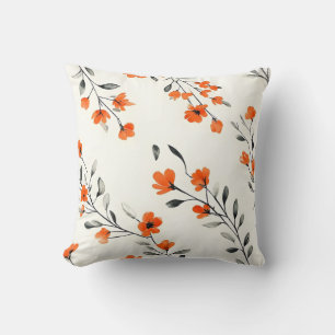 Naranja audaz y almohada de acento floral gris