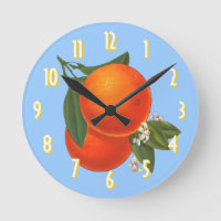 Naranjas en el reloj azul de arte de cartón