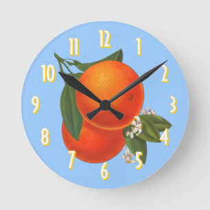 Naranjas en el reloj azul de arte de cartón