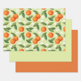 Naranjas, hojas verdes y patrón de flores blancas