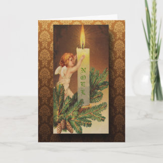 Navidad del ángel y de la luz de una vela del