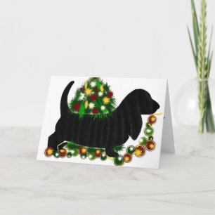 Navidad que saluda el perro del Bassett de Card~