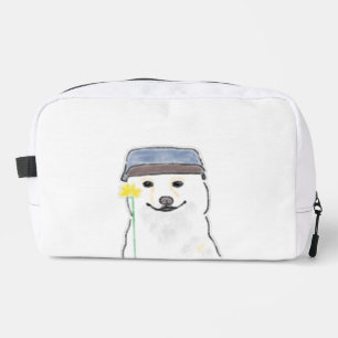 Neceser Perro blanco lindo que lleva sombrero sosteniendo