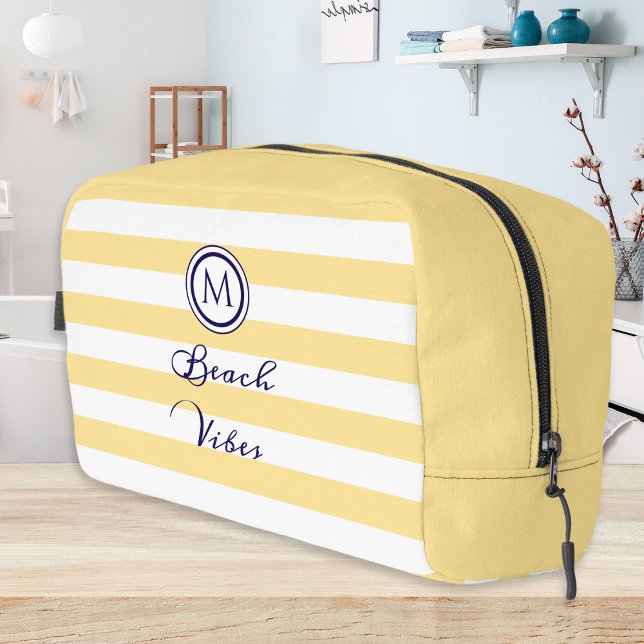Neceser Vibes de playa rayadas amarillas y blancas monogra (A toiletry bag with fresh buttermilk yellow stripes, monogram and 'Beach Vibes' in script typography)