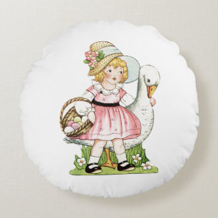 Niña pequeña y almohada redonda de Pascua