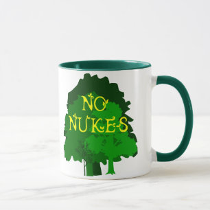 Ningunas armas nucleares con la taza de café verd