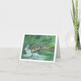 Niño capturando una tarjeta de notas de pescado