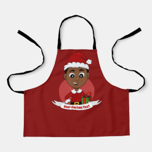 Niño navidad con un delantal gorra rojo