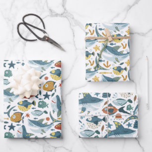 Niño tiburón envuelve hojas de papel de 3