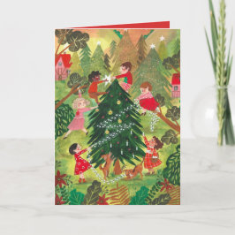 Niños adorables árbol de Navidad verde decorado