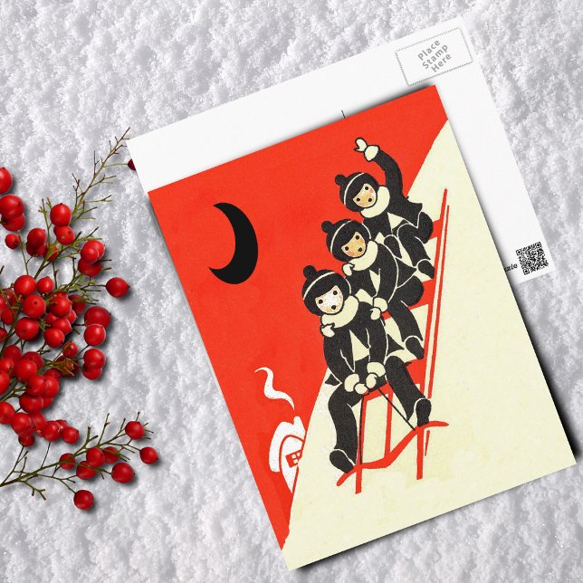 Niños en una postal de la escena de invierno (Three boys riding red sled down snow covered hill Black moon house on red Postcard.)