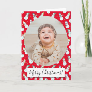 Niños Navidades cortan a hombre de nieve en foto r