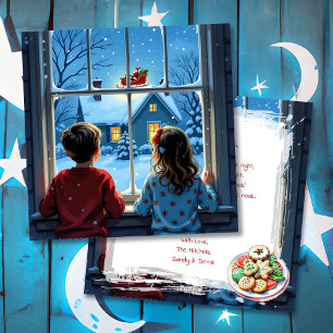 Niños viendo el trineo de Santa en Navidad