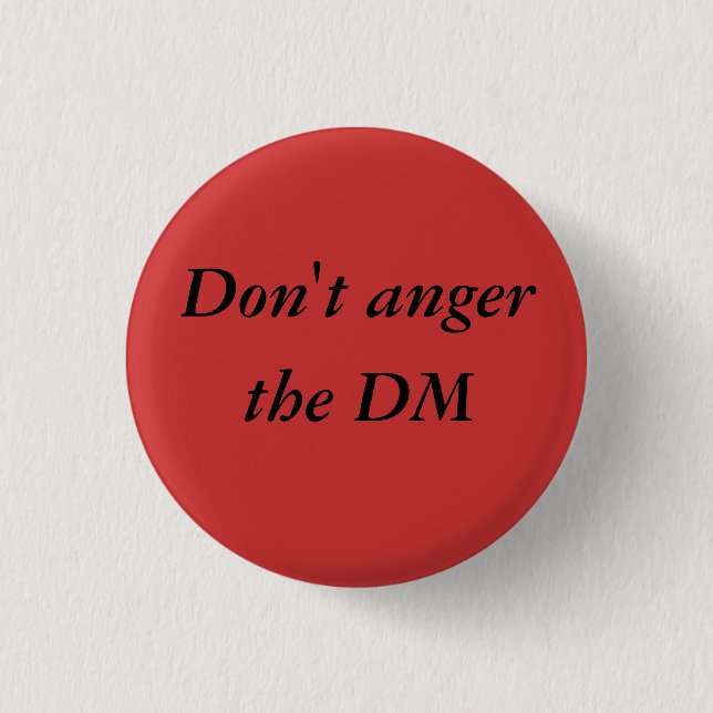 No enoje el botón del pinback del DM (Anverso)