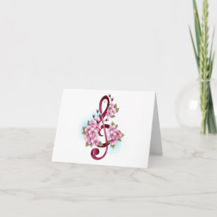 Notas de clave de sol musical con flores de Sakura