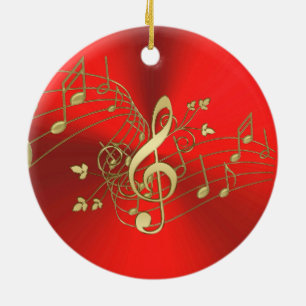Notas de la música del oro y ornamento rojos del