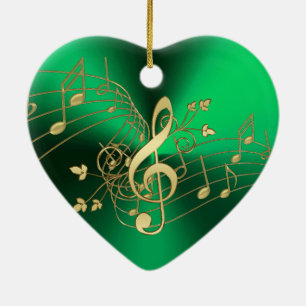 Notas de la música y ornamento verdes del navidad