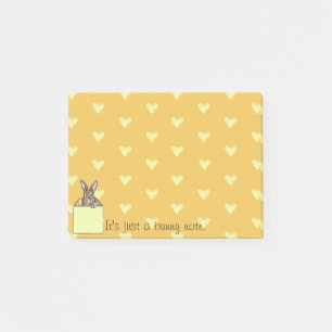Notas Post-it® conejo amarillo en la caja