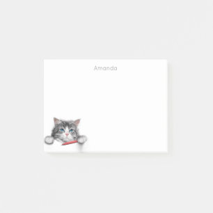Notas Post-it® Un gato gracioso y lindo con un bolígrafo rojo aña