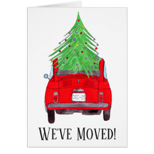 Nueva dirección Coche rojo con árbol de Navidad