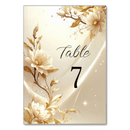 Número de mesa de flores blancas y doradas