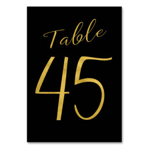 Número de mesa elegante negro con brillo dorado de