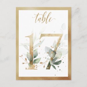 Números de mesa dorados con follaje verde, tarjeta
