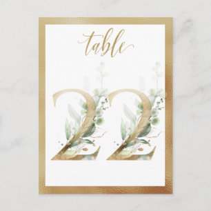 Números de mesa dorados con follaje verde, tarjeta