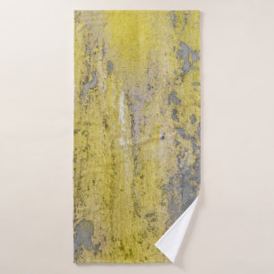 Old gray concrete wall with peeling yellow paint.