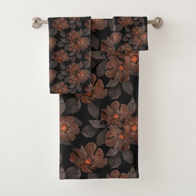 Orange and brown flowers on a black background. (In situ)