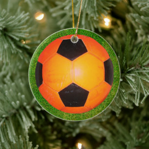 Ornamento de la pelota de fútbol naranja y negro