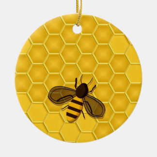 Ornamento de oro del panal con las abejas