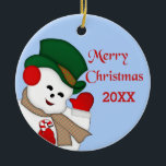 Ornamento de Waving Snowman Merry Christmas 20XX<br><div class="desc">Cambie el fondo azul claro detrás de este diseño a cualquier color que prefiera. Este muñeco de nieve es una imagen vintage que he coloreado/rediseñado completamente. He dejado el dorso del adorno en blanco en funda que quieres personalizar - de una familia o persona a otra, o un comentario personal,...</div>