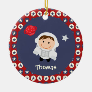 Ornamento del astronauta de las estrellas rojas y