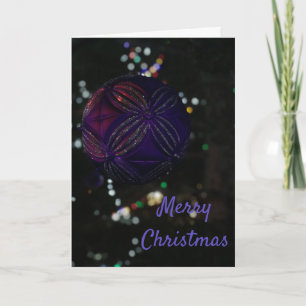 Ornamento morado de navidad de Feliz