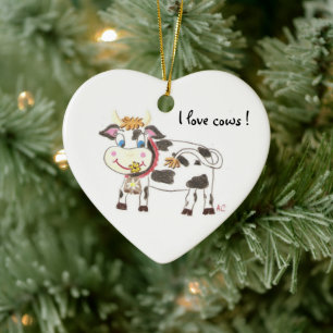 Ornamento navideño de cerámica de vaca suiza en fo