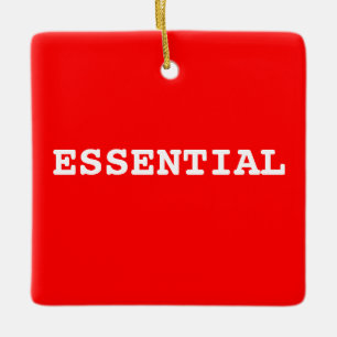 Ornamento rojo que dice esencial