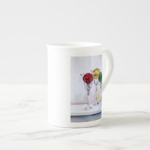 Ornamentos del navidad en taza de la porcelana de