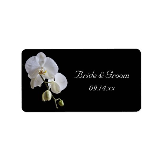 Orquídea blanca en etiqueta negra del favor del