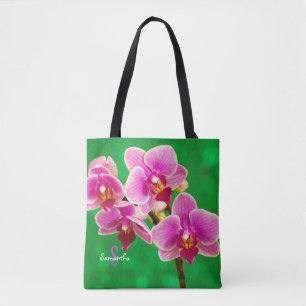 Orquídea púrpura en bolsa tote verde