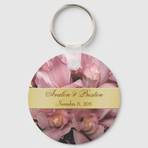 Orquídeas rosadas que casan llavero del oro del