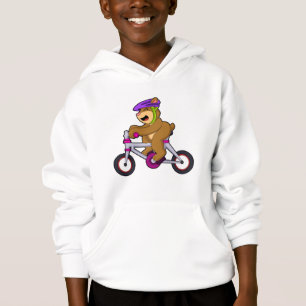 Oso con bicicleta y casco