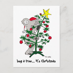 Oso de koala que abraza un árbol de navidad