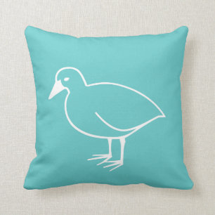 pájaro blanco sobre almohada azul verde azulada