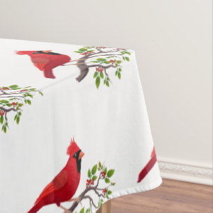 Pájaro cardenal rojo sobre manteles blancos