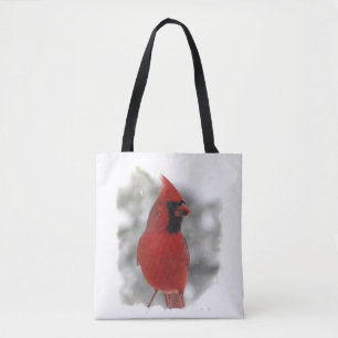 Pájaro cardinal rojo en la bolsa de asas del