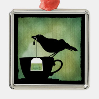 Pájaro en un ornamento de la taza de té