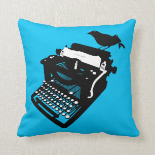 Pájaro en una almohada de la máquina de escribir